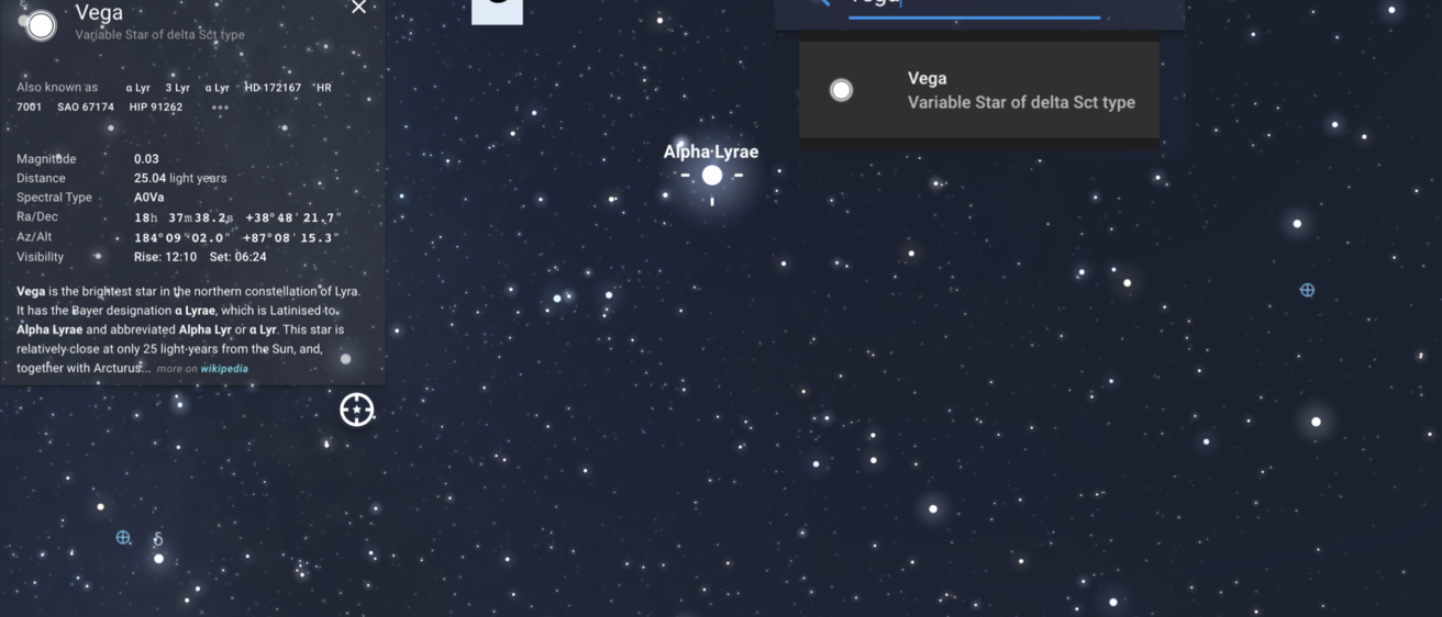 A digital view of the night sky is shown, with the view zoomed in on the sky to center on the star Vega. A menu is included.